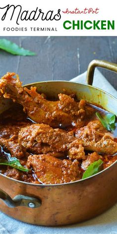 a close up of a pot of food with meat in sauce and garnishes