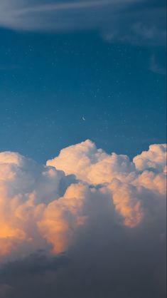 the sky is filled with clouds and stars