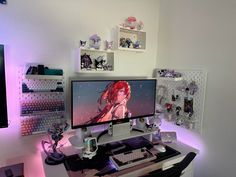 a computer monitor sitting on top of a desk next to a keyboard and mouse pad