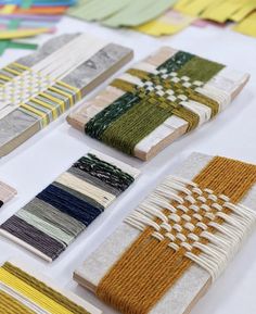 several different types of weavings laid out on a table with each one being woven