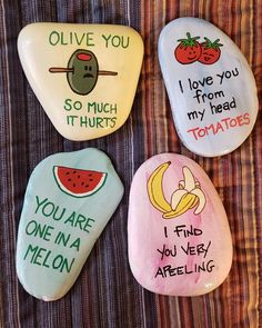 four painted rocks with different sayings on them