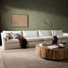 a living room filled with furniture and a coffee table