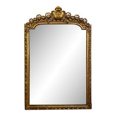 an ornate gold framed mirror against a white background