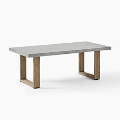 a concrete table with wooden legs on a white background