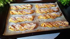 there are many pastries on the baking sheet