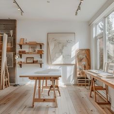 a room filled with lots of wooden furniture and art work on display in front of large windows