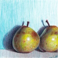 two green apples sitting next to each other on a blue tablecloth with a light colored background