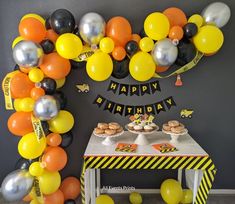 a birthday party with balloons and desserts