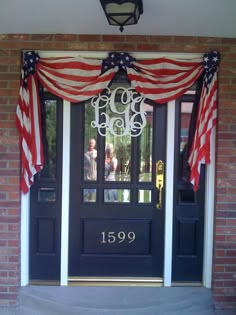 an american flag draped over the front door