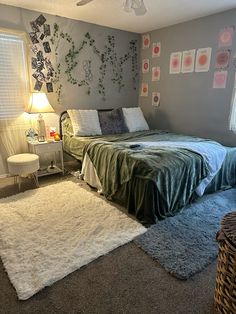 a bed room with a neatly made bed next to a window and a rug on the floor