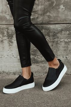 Your classic sneaker gets a major upgrade with the Lulus Cassay Black Crocodile-Embossed Platform Slip-On Sneakers! Matte crocodile-embossed faux leather shapes these slip-on sneakers that have a rounded toe upper and elastic gussets for fit. Pull tab at back. 1.5"" white bumper sole. 1. 5" Platform Sole. Lightly Cushioned Insole. Rubber Sole Has Nonskid Markings. All Man Made Materials. Imported. Lulus | Cassay Black Crocodile-Embossed Platform Slip-On Sneakers | Size 6.5. Nyc Wardrobe, Black Platform Sneakers, Slip On Tennis Shoes, Platform Slip On Sneakers, Black Tennis Shoes, Black Casual Shoes, Black Slip On Sneakers, Flatform Sneakers, Tennis Shoes Outfit