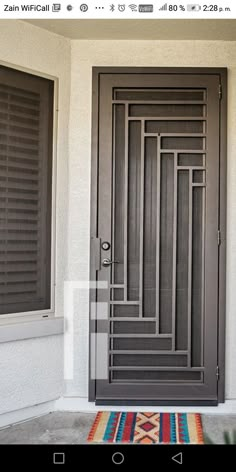 an open door on the side of a house with shutters in front of it