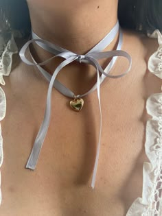 'Cherie' is a beautiful, adjustable ribbon necklace with a heart along side the clasp for ease of use. This jewelry item is made to order, which means the ribbon color could be slightly changed along with the heart charm.  As a perfect coquette gift, Venice is a beautiful addition to any wardrobe. This product is custom made to ship and will take three to seven days of processing time. Ribbons As Accessories, Blue Ribbon Necklace, Ribbon As Necklace, Lace Ribbon Necklace, Ribbon Locket Necklace, Ribbon Bow Jewelry, Ribbons In Clothes, Ribbon Accessories Fashion, Red Ribbon Necklace