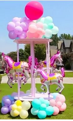 there is a carousel with balloons on it