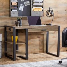 a laptop computer sitting on top of a wooden desk in front of a wall mounted book shelf