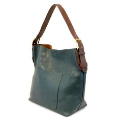 Equally timeless and modern, Joy Susan's best-selling classic hobo is made in rich vegan leather in beautiful colors always accented with neutral straps. This roomy bag accented with a large front pocket and a snap-in removable crossbody, has plenty of room to carry your needs in style. Main Bag: 12″ high, 14″ wide, 6″ deep Adjustble strap drop: 6″-11″ Magnetic snap top closure Exterior open pocket Two snaps to attach insert to act as lining Brass plated hardware 100% Vegan leather (polyurethane European Shoes, Vegan Purses, Hobo Crossbody Bag, Handbag Outfit, Hobo Handbag, Leather Hobo Bag, Prada Handbags, Hobo Handbags, Dark Teal