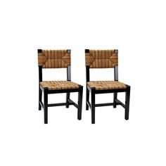 a pair of chairs with woven seats on them