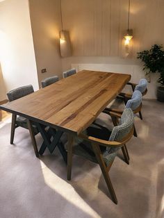 a large wooden table with chairs around it