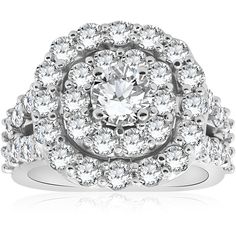 a white gold ring with two rows of diamonds on the band and an oval center surrounded by smaller round stones