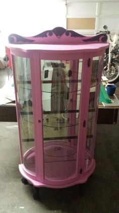 a pink display case sitting on top of a table