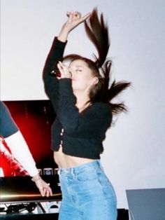 a woman with her hair in the air