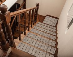 the stairs are made of wood and carpet