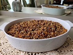 a white casserole dish filled with granola