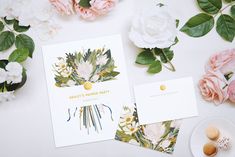 two cards with flowers on them next to macaroni shells and eggs in front of the card