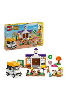 a lego box with an assortment of toys in front of it and a toy truck next to it