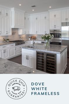 a kitchen with white cabinets and marble counter tops