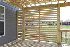 a porch with wooden slats on it