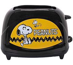 a black and yellow peanuts toaster with snoopy on it's front side