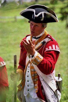 a man dressed in an old fashioned costume