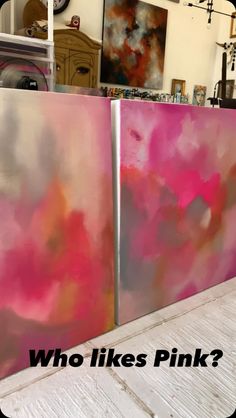 two metal refrigerators sitting next to each other on a wooden floor with the words who likes pink?