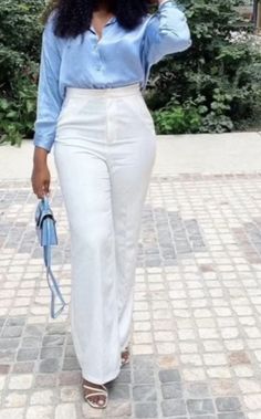 Sky blue button up shirt tucked into white trousers with sky blue bag and strappy heels. Blue And White Classy Outfit, White Trousers Blue Shirt, White Pants Blue Shirt, White Tan Outfit, Blue Trousers Outfit, Satin Blouse Outfit, Brunch Attire, Pant Outfits For Women