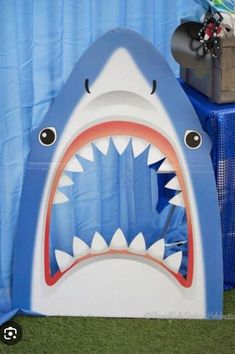 an inflatable shark is on display at a party