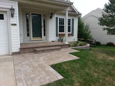 a house with steps leading to the front door