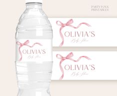 two water bottles with pink ribbons on them and the label for oliva's