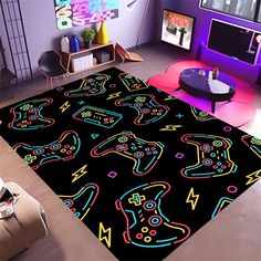 a living room with a rug that has neon colored video game artwork on the floor