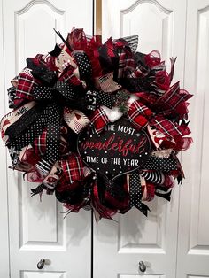 a red and black mesh wreath with the words'the most wonderful time of the year '