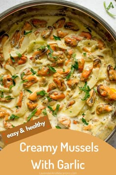 a pan filled with pasta and shrimp on top of a table