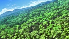 an aerial view of trees and mountains in the distance