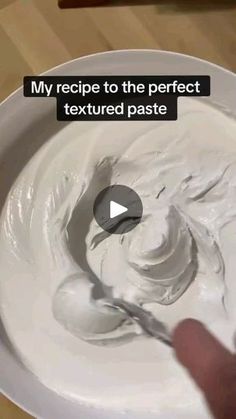 a person is mixing white cream in a bowl with a spoon and the caption reads, my recipe to the perfect textured paste