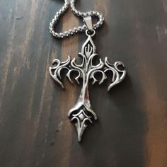 Stunningly beautiful piece of jewellery this gothic flame cross necklace, unique stylish,  wear with a unique and  elegant design will look amazing with any outfit and occasion. Ideal unique gift idea that will sure to impress. Gothic Stainless Steel Cross Pendant Jewelry, Handmade Gothic Cross Pendant Necklace, Gothic Stainless Steel Cross Necklace, Gothic Jewellery, Unisex Necklace, Necklace Unique, Unisex Jewelry, Gothic Jewelry, Pendant Necklaces