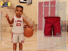 a little boy in a basketball uniform holding a basketball and posing for the camera with his hand up