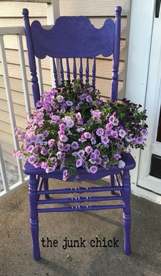 a blue chair with purple flowers in it and the words the junk chick written below