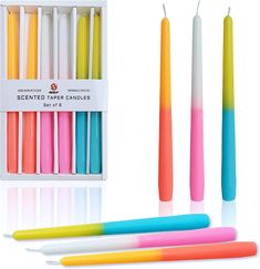 multicolored candles are arranged in a box