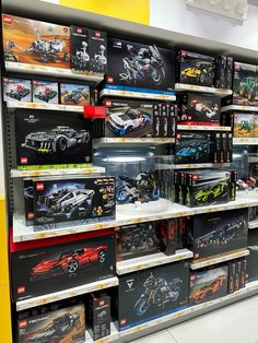 there are many toy cars on display in the store