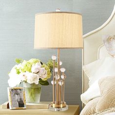 Introducing our exquisite Valentine Nightstand Lamp, designed to effortlessly elevate the ambiance of any bedroom. Crafted with a gold fabric drum shade, this traditional lighting piece exudes elegance and sophistication. The shimmering gold finish of the base is tastefully complemented by a stunning clear crystal ball decoration, adding a touch of glamour and luxury to your space. This 1-light lamp combines functionality with style, providing a soft and warm glow that sets the perfect mood for relaxation or intimate moments. Its compact size makes it a perfect fit for nightstands, dressers, or bedside tables. Bring a touch of romance and timeless beauty to your bedroom with the Valentine Nightstand Lamp in Gold – a true statement piece for any discerning taste.Size: 14 to 15 Inch Length: Bedroom Nightstand Lamp, Gold Nightstand, Bedroom Lamps Nightstand, Tiger Decor, Bedroom Nightstand, Copper Chandelier, Light Bedroom, Nightstand Lamp, Traditional Lighting