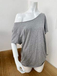 Off The Shoulder Slouchy T Shirt 100% Cotton Raw Cut Neck and Sleeves Traditional Hem  The off-the-shoulder cotton slouchy T-shirt is a piece that embodies both comfort and style. Handmade from 100% cotton fabric, it offers a natural and breathable feel. The raw cut neckline and sleeves, along with the traditional hem at the bottom, create a relaxed yet stylish look that can easily transition from casual outings to yoga or gym sessions. With availability in a wide variety of colors, this T-shirt Off The Shoulder T-shirt, Off The Shoulder Outfit Casual, No Sleeves Shirt, Loose Off The Shoulder Top, Basic Clothes For Women, One Shoulder T Shirt, How To Make A Off Shoulder Shirt, Shirt Under T Shirt Outfit, Cut Shoulder Shirt